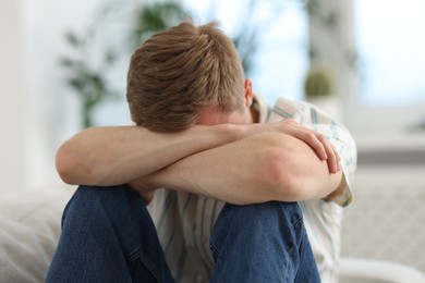 Photo of Sad man at home. Depression and anxiety