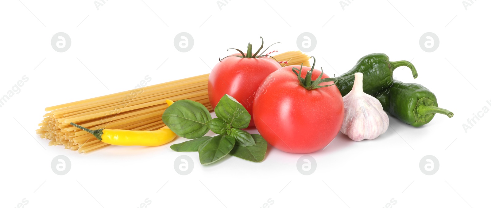 Photo of Raw spaghetti pasta and different ingredients isolated on white