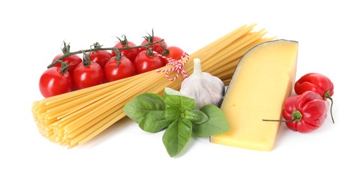 Photo of Raw spaghetti pasta and different ingredients isolated on white