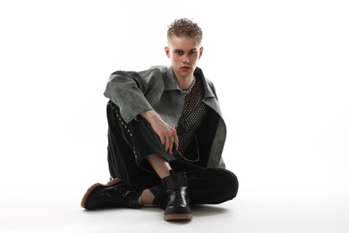 Photo of Handsome young man wearing stylish jacket on white background