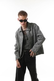 Photo of Handsome young man wearing stylish jacket and sunglasses on white background