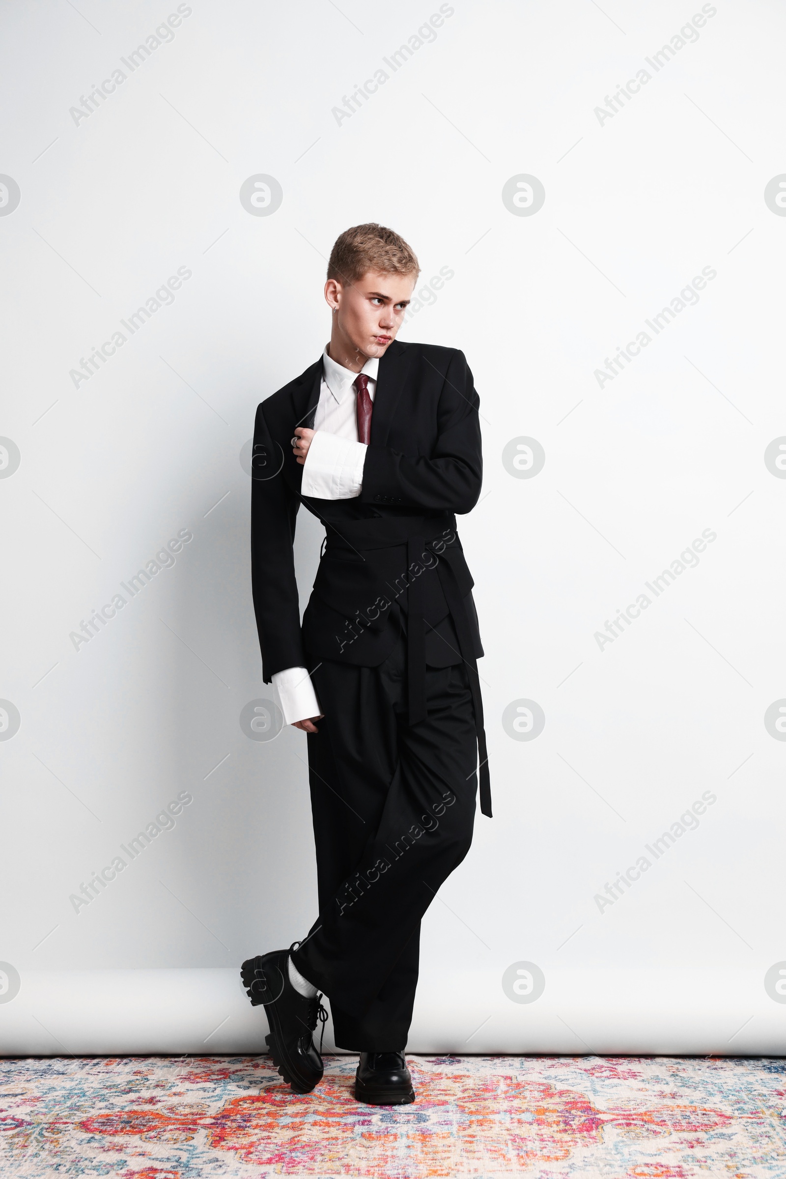Photo of Handsome young man wearing stylish suit on white background
