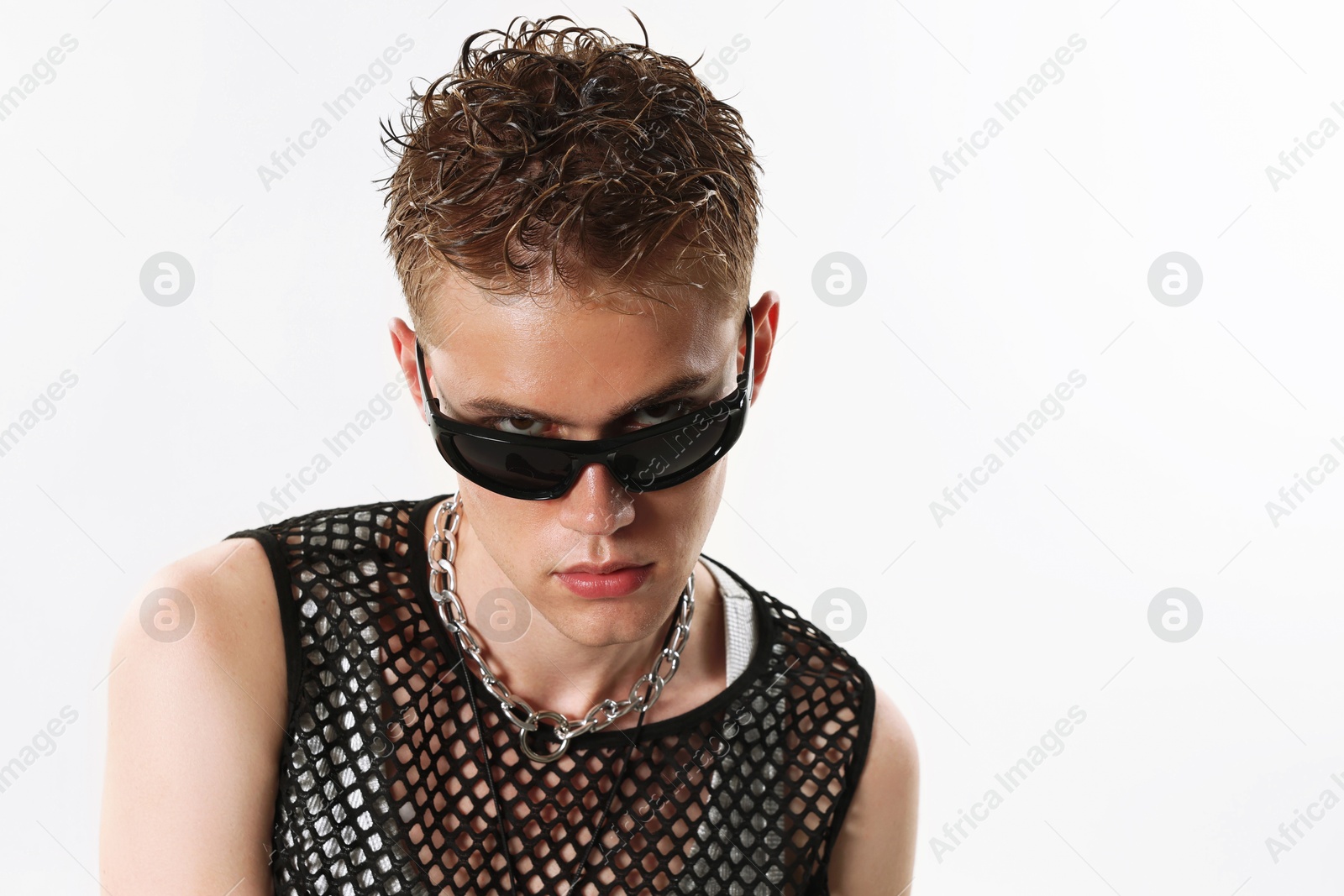 Photo of Handsome young man wearing sunglasses on white background, space for text