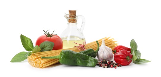 Photo of Raw spaghetti pasta and different ingredients isolated on white