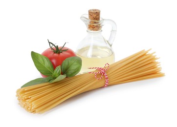 Photo of Raw spaghetti pasta and different ingredients isolated on white