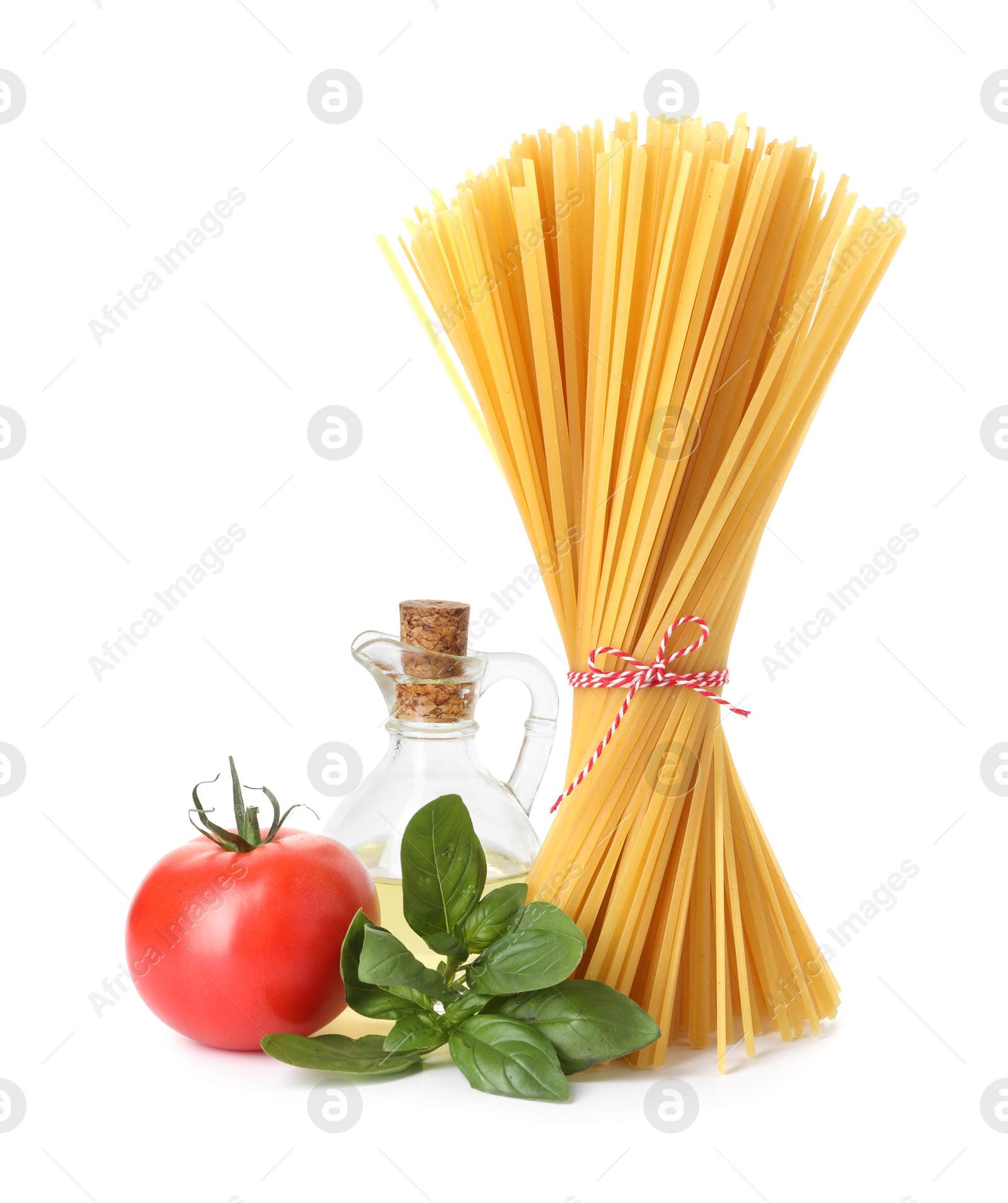 Photo of Raw spaghetti pasta and different ingredients isolated on white
