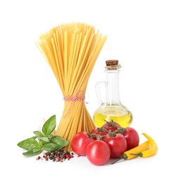 Photo of Raw spaghetti pasta and different ingredients isolated on white