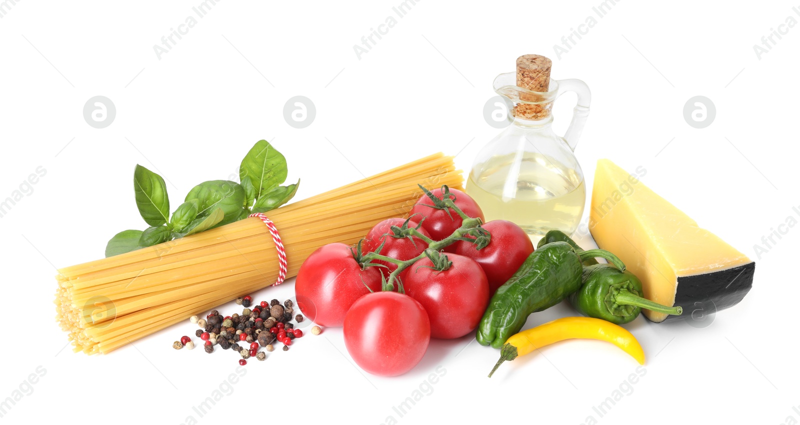 Photo of Raw spaghetti pasta and different ingredients isolated on white