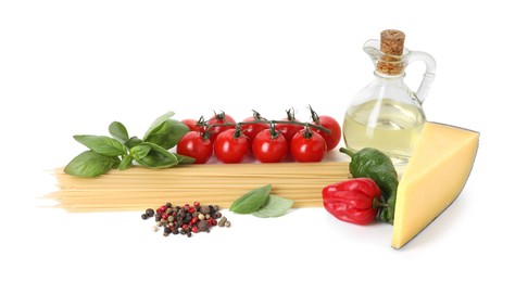 Photo of Raw spaghetti pasta and different ingredients isolated on white
