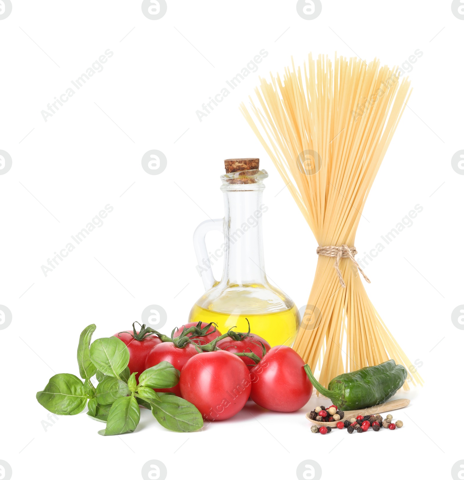 Photo of Raw spaghetti pasta and different ingredients isolated on white