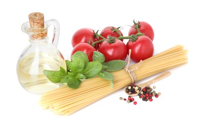 Photo of Raw spaghetti pasta and different ingredients isolated on white