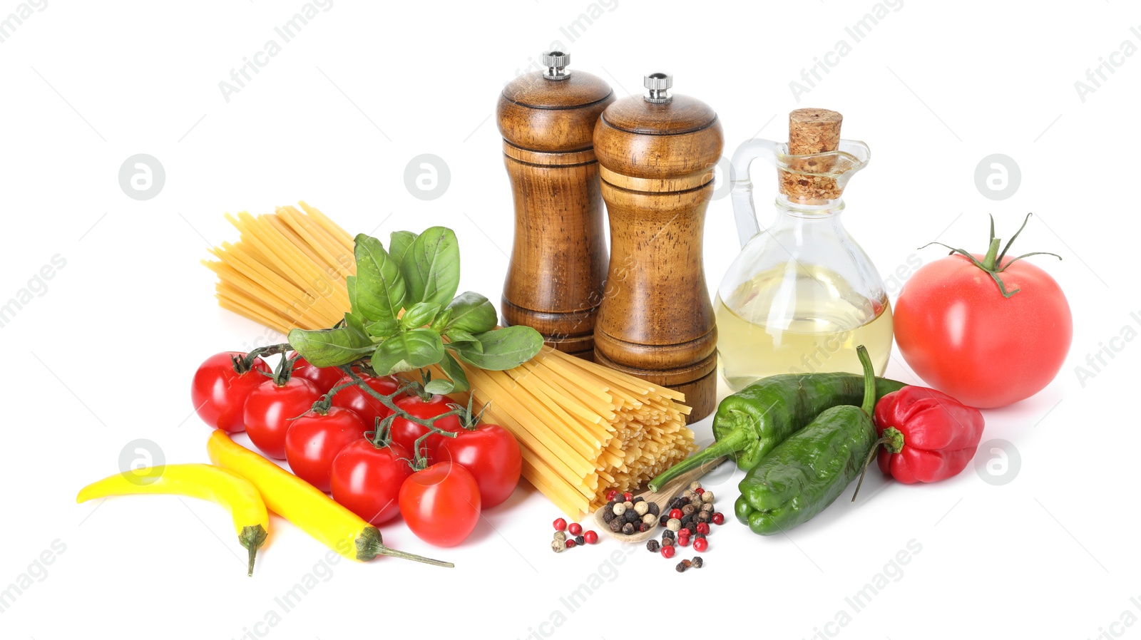 Photo of Raw spaghetti pasta and different ingredients isolated on white