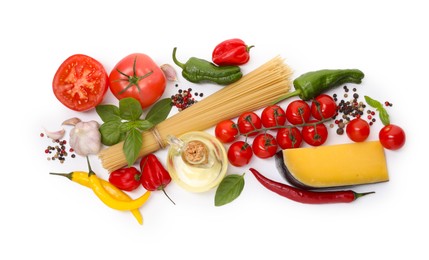 Photo of Raw spaghetti pasta and different ingredients isolated on white, top view