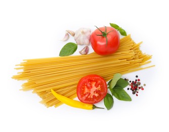 Photo of Raw spaghetti pasta and different ingredients isolated on white, top view