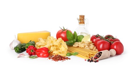 Photo of Different types of pasta and ingredients isolated on white