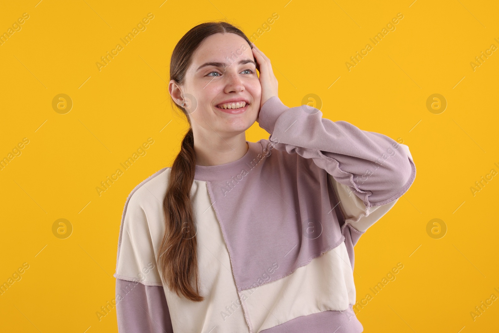 Beautiful woman laughing on yellow background. Positive emotion Photo of Beautiful woman laughing on yellow background. Positive emotion