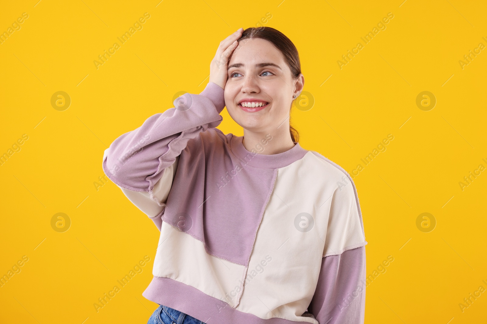 Beautiful woman laughing on yellow background. Positive emotion Photo of Beautiful woman laughing on yellow background. Positive emotion