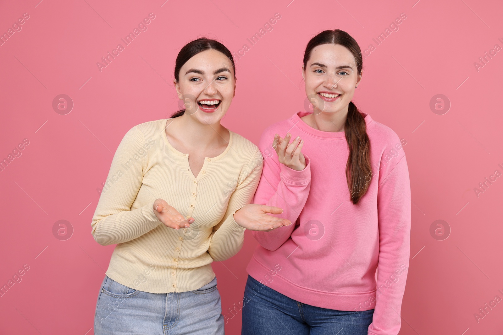 Beautiful women laughing on pink background. Positive emotion Photo of Beautiful women laughing on pink background. Positive emotion