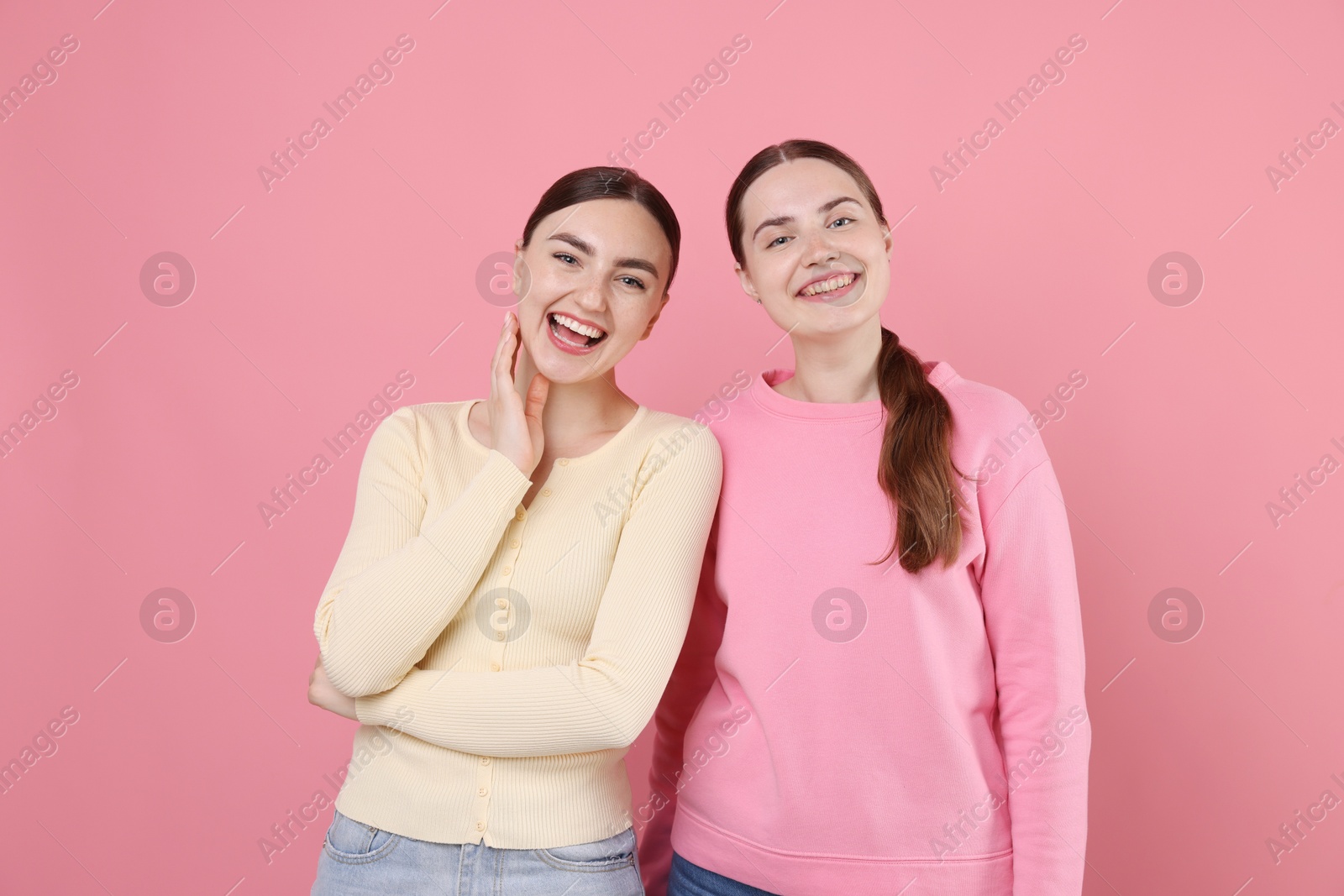 Beautiful women laughing on pink background. Positive emotion Photo of Beautiful women laughing on pink background. Positive emotion