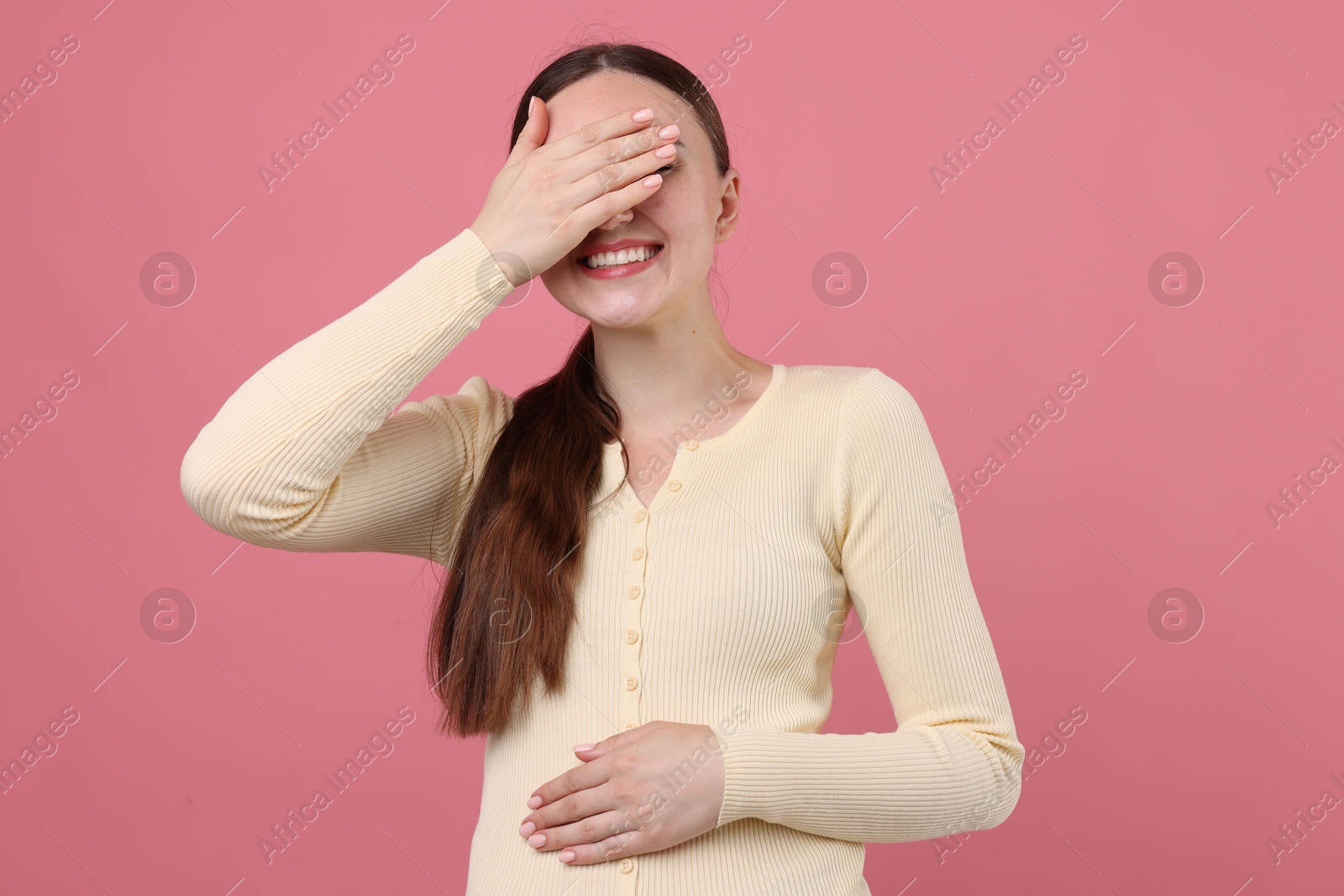 Beautiful woman laughing on pink background. Positive emotion Photo of Beautiful woman laughing on pink background. Positive emotion