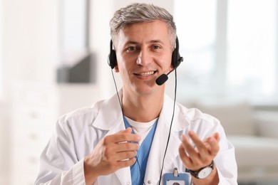 Photo of Telemedicine. Doctor having video call with patient, view from camera