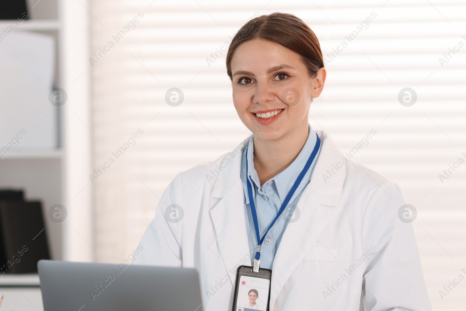 Telemedicine. Doctor having video call with patient via laptop indoors Photo of Telemedicine. Doctor having video call with patient via laptop indoors