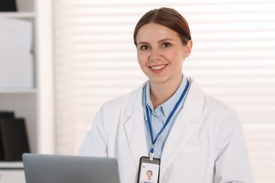Photo of Telemedicine. Doctor having video call with patient via laptop indoors