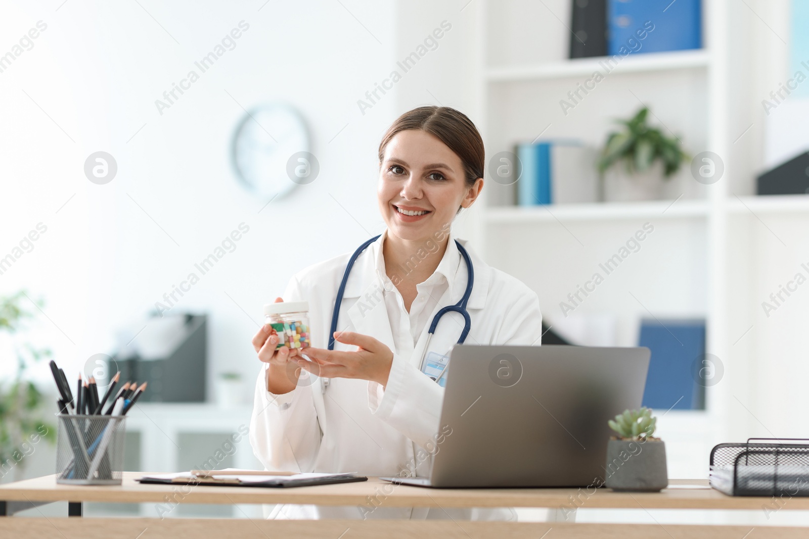 Telemedicine. Doctor recommending pills to patient during video call via laptop indoors Photo of Telemedicine. Doctor recommending pills to patient during video call via laptop indoors