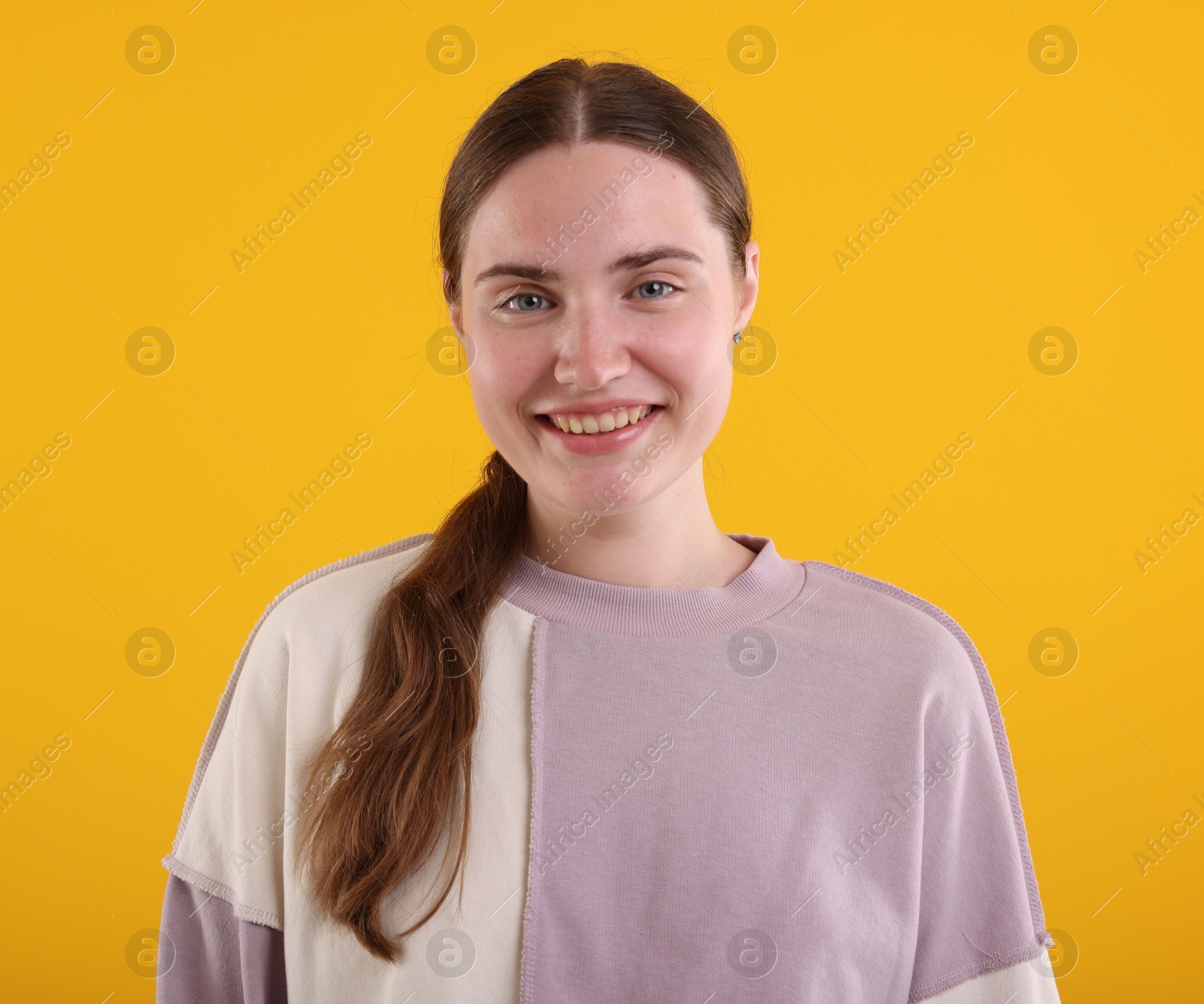 Beautiful woman laughing on yellow background. Positive emotion Photo of Beautiful woman laughing on yellow background. Positive emotion