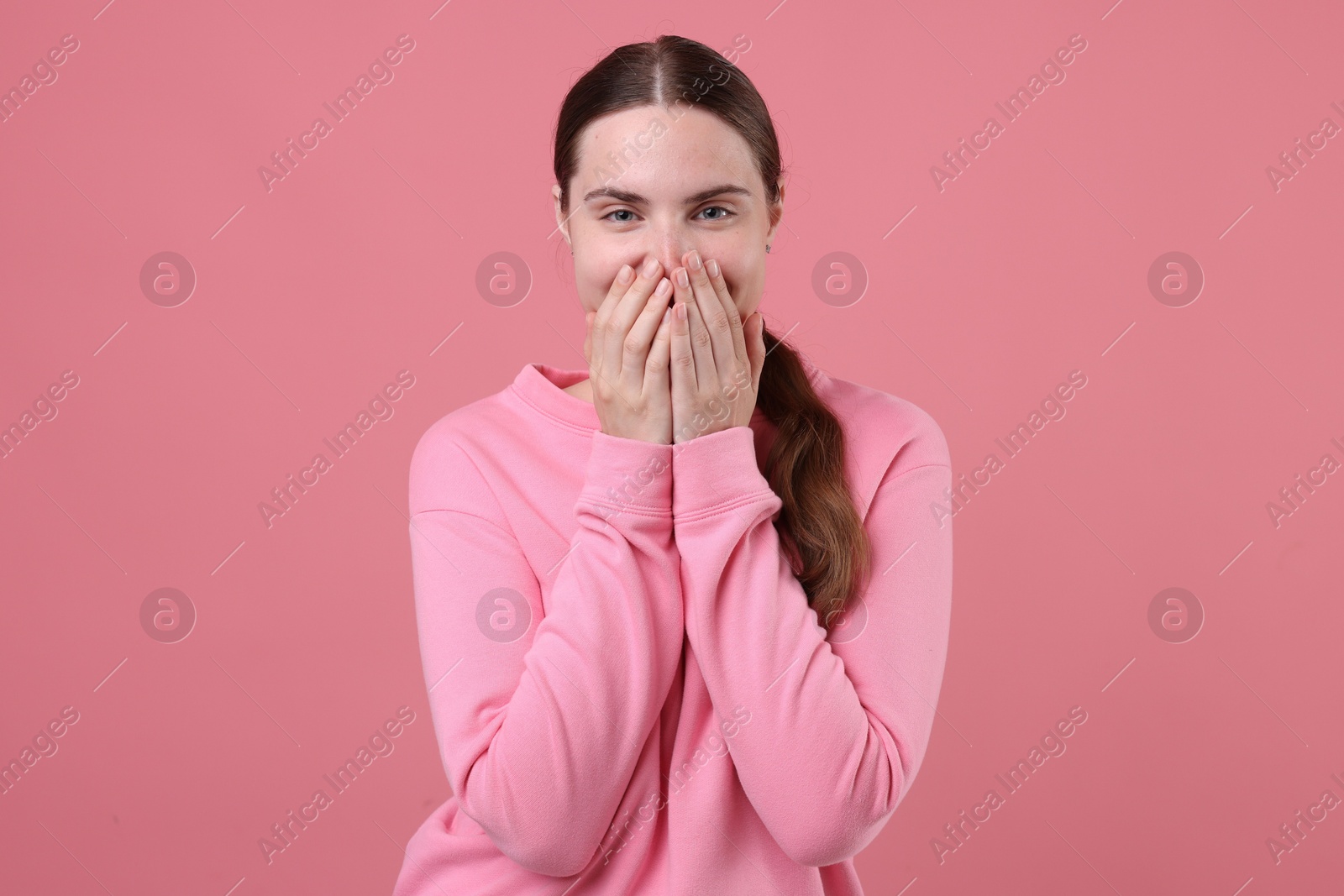 Beautiful woman laughing on pink background. Positive emotion Photo of Beautiful woman laughing on pink background. Positive emotion