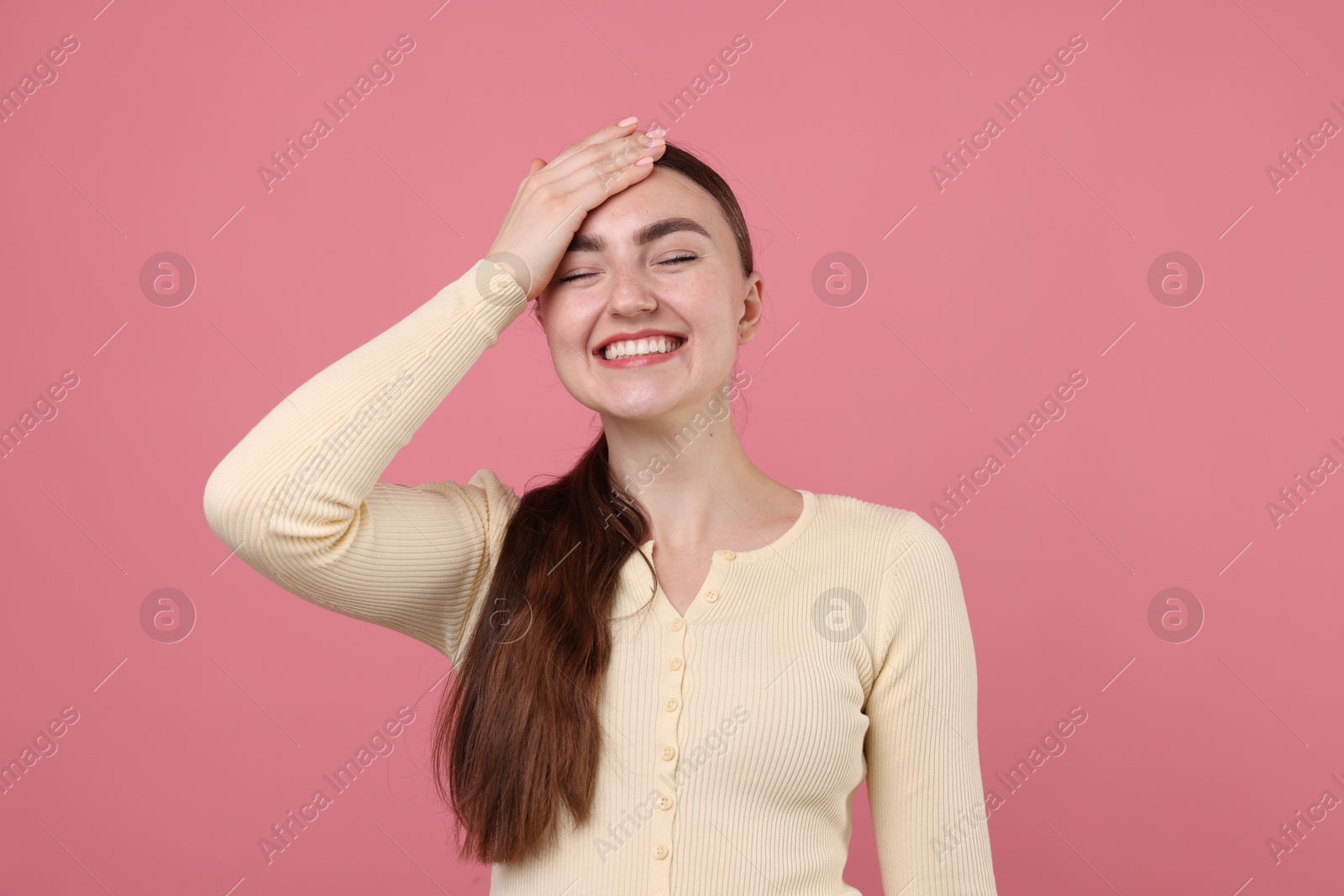 Beautiful woman laughing on pink background. Positive emotion Photo of Beautiful woman laughing on pink background. Positive emotion