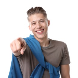 Photo of Handsome man laughing and pointing at something on white background. Positive emotion