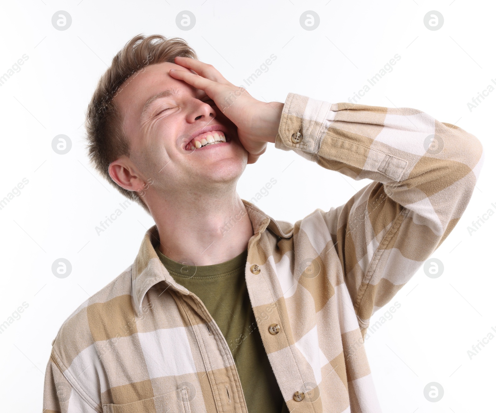 Handsome man laughing on white background. Positive emotion Photo of Handsome man laughing on white background. Positive emotion
