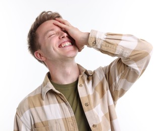 Photo of Handsome man laughing on white background. Positive emotion