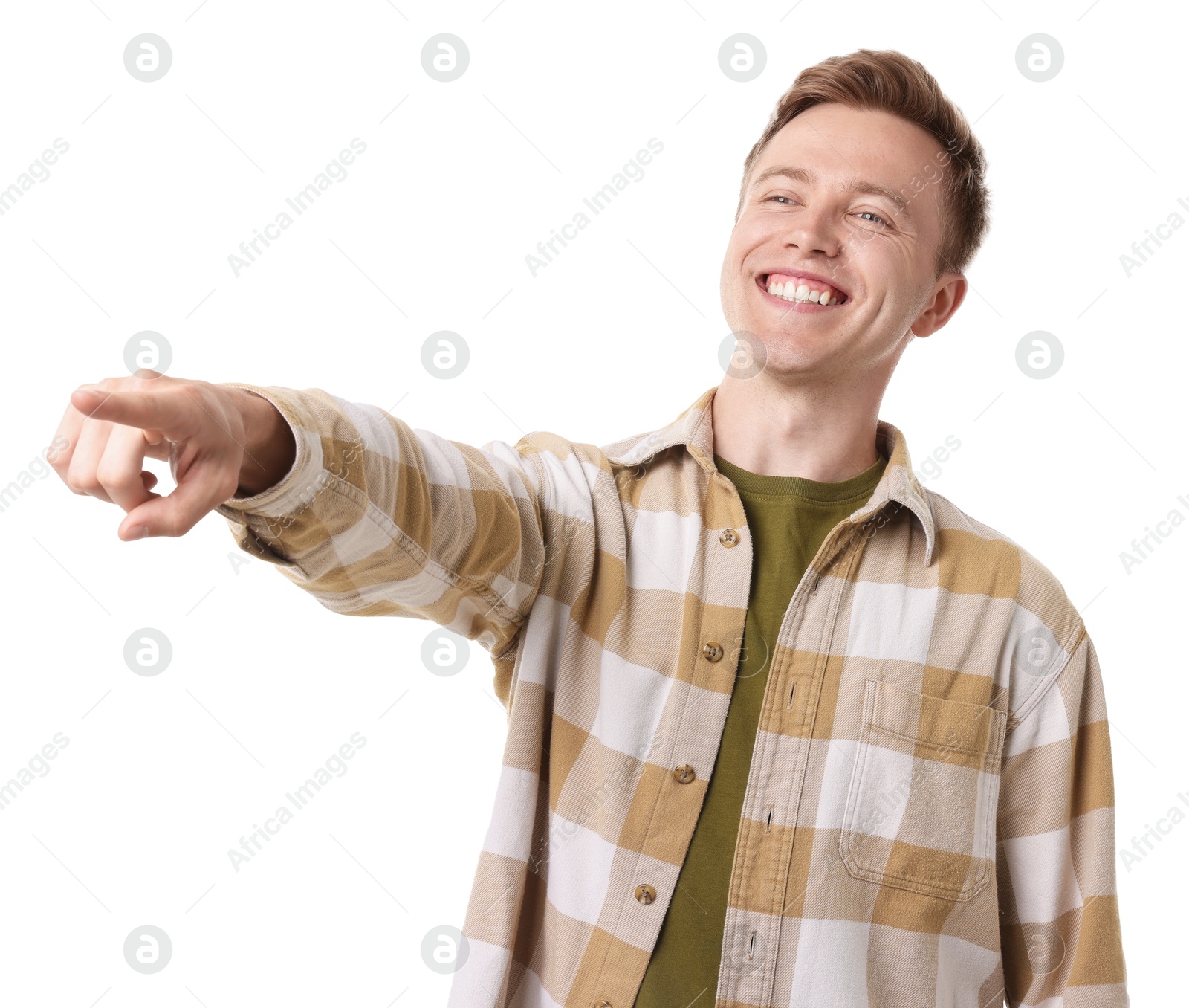 Handsome man laughing and pointing at something on white background. Positive emotion Photo of Handsome man laughing and pointing at something on white background. Positive emotion
