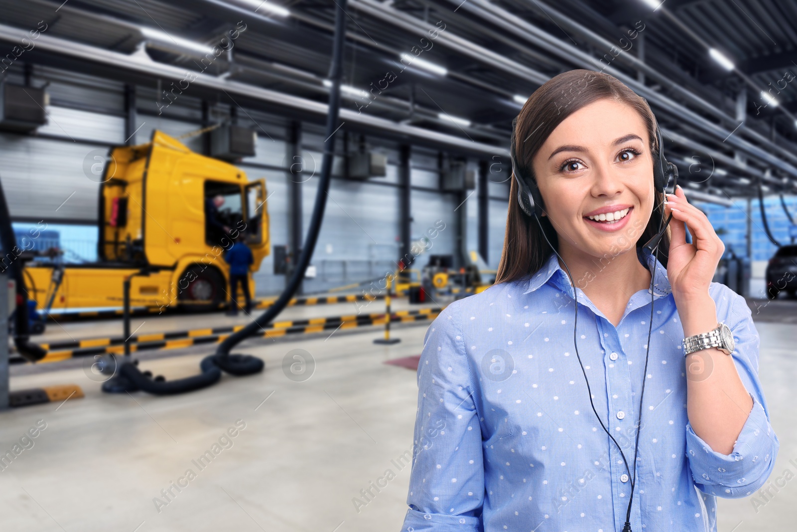 Car service worker with headset against truck at station. Client support Image of Car service worker with headset against truck at station. Client support