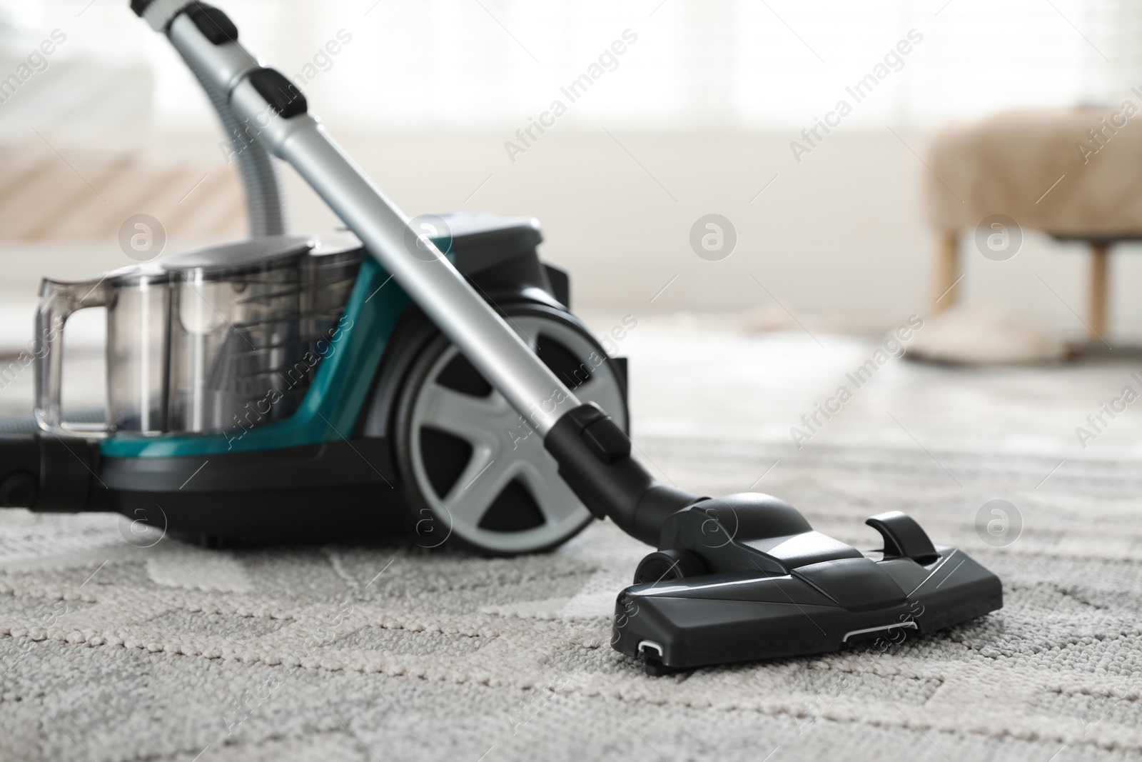 One vacuum cleaner on floor indoors, closeup Photo of One vacuum cleaner on floor indoors, closeup