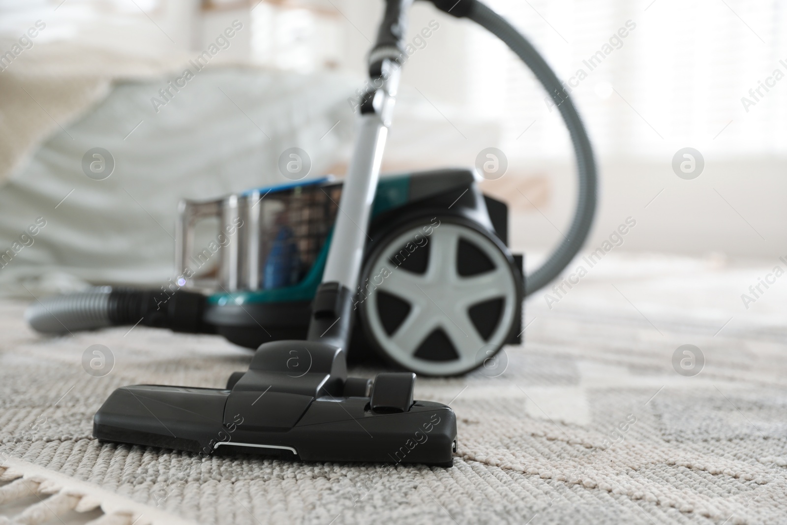 One vacuum cleaner on floor indoors, closeup Photo of One vacuum cleaner on floor indoors, closeup