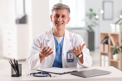 Photo of Telemedicine. Doctor having video call with patient, view from camera
