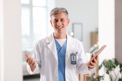 Photo of Telemedicine. Doctor with tablet having video call with patient, view from camera