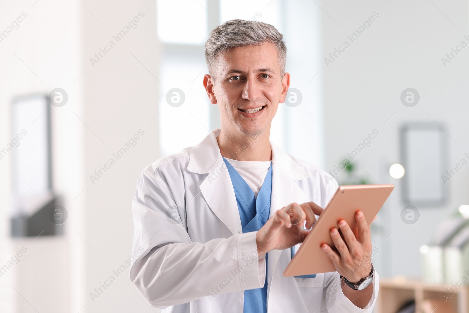 Photo of Telemedicine. Doctor with tablet having video call with patient, view from camera
