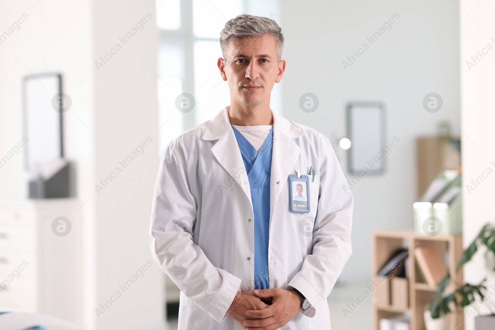 Portrait of doctor in white coat indoors Photo of Portrait of doctor in white coat indoors