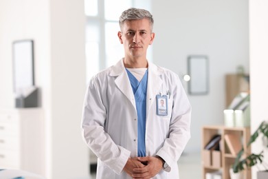 Photo of Portrait of doctor in white coat indoors