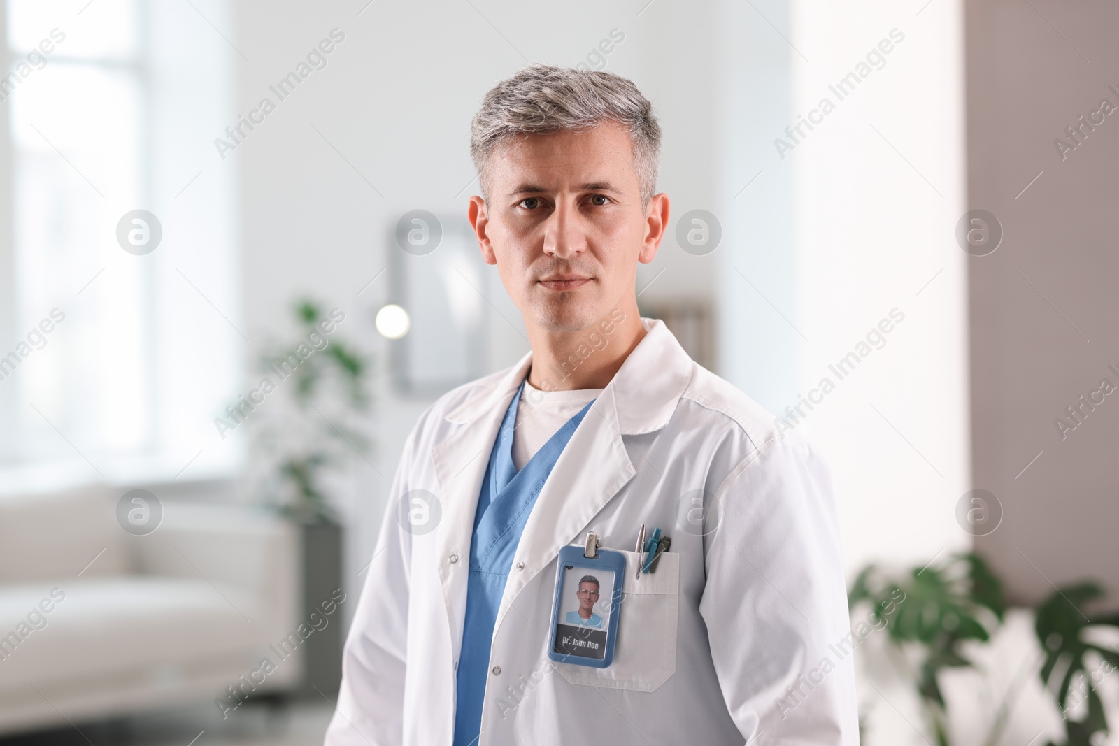 Portrait of doctor in white coat indoors Photo of Portrait of doctor in white coat indoors