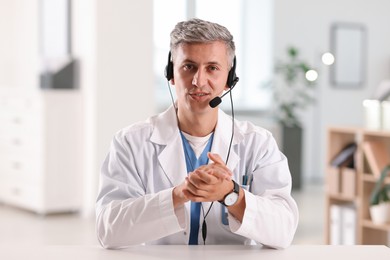 Photo of Telemedicine. Doctor having video call with patient, view from camera