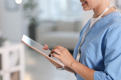 Photo of Telemedicine. Doctor with tablet in office, closeup