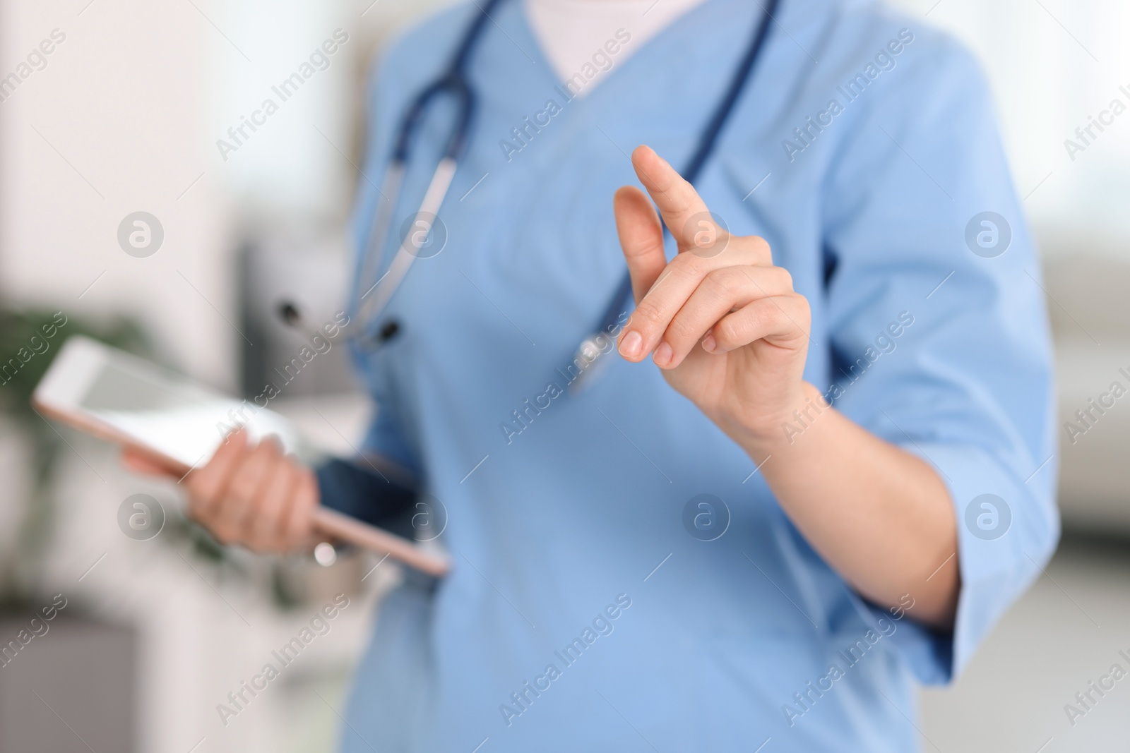 Telemedicine. Doctor with tablet in office, closeup Photo of Telemedicine. Doctor with tablet in office, closeup