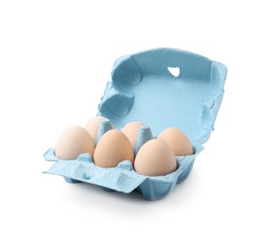 Photo of Raw chicken eggs in egg carton isolated on white