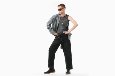 Photo of Handsome young man wearing stylish jacket and sunglasses on white background