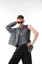 Photo of Handsome young man wearing stylish jacket and sunglasses on white background